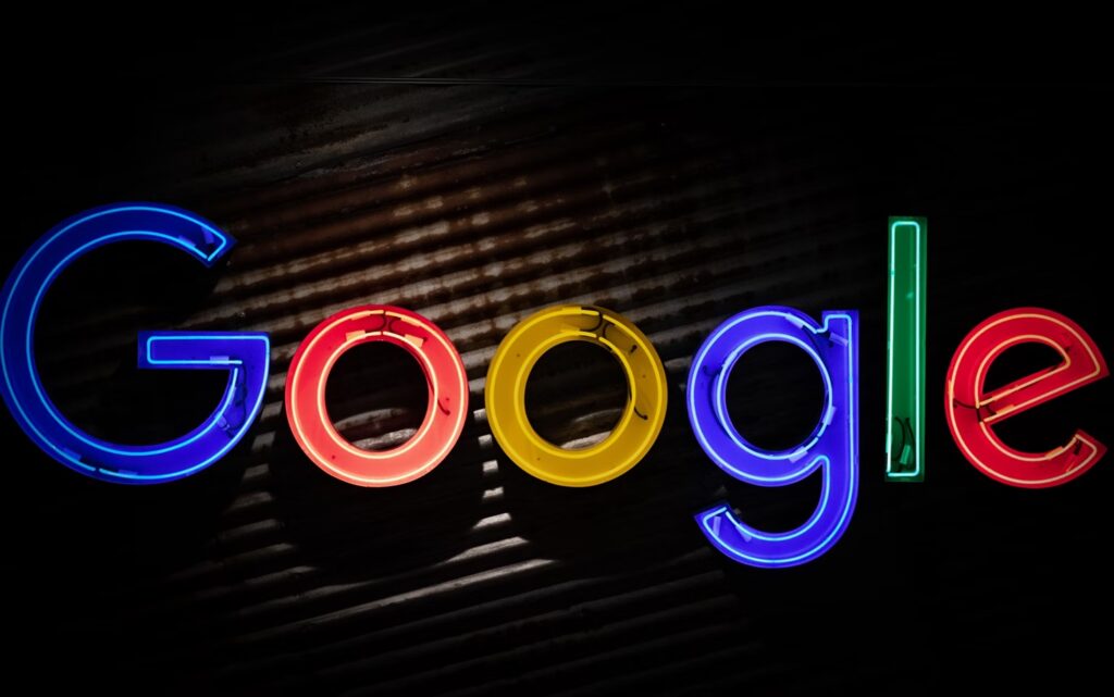 Google logo lit up on a dark background